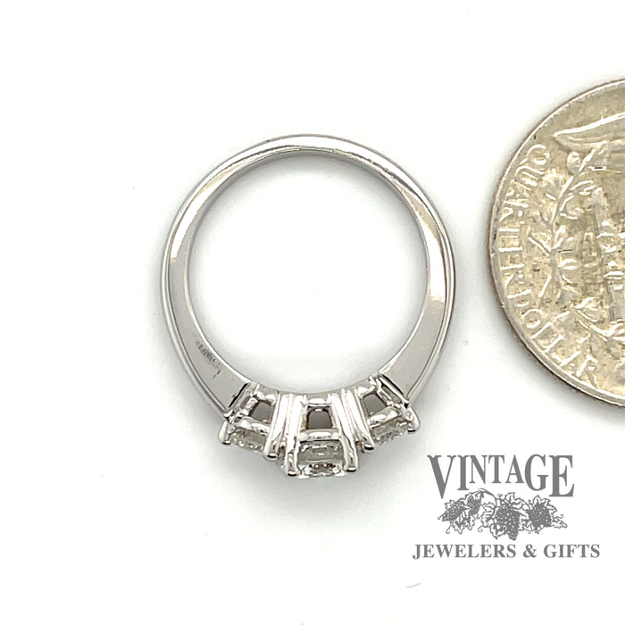 14 karat white gold 1.23 carat total weight three stone diamond ring, shown next to quarter for size reference