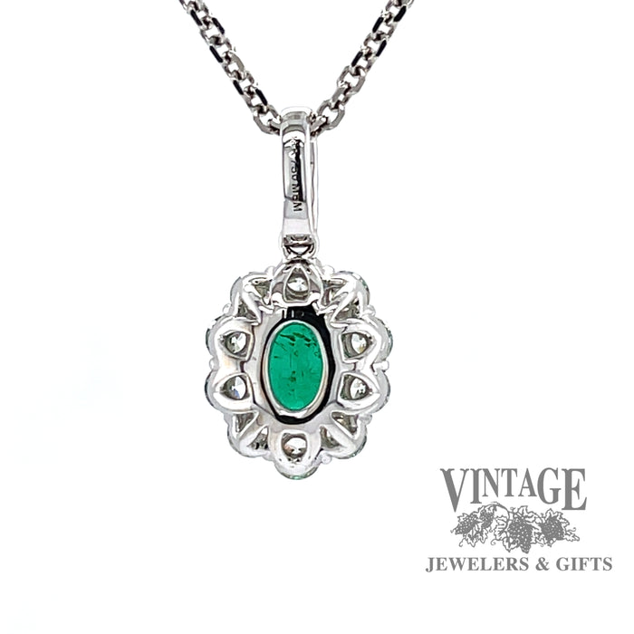 Emerald and diamond 18k white gold halo pendant.