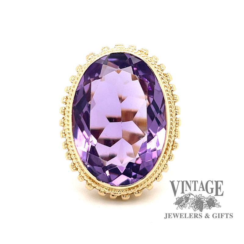 Oval bezel set amethyst 18ky gold ring top
