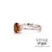 14 karat white gold oval citrine ring with diamond clusters, side view