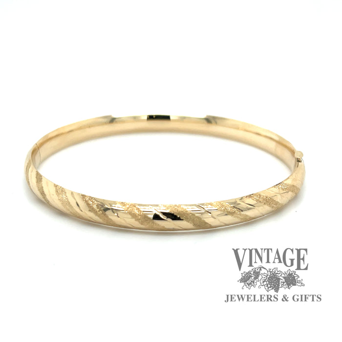 Hinged 14ky gold striped pattern bangle bracelet