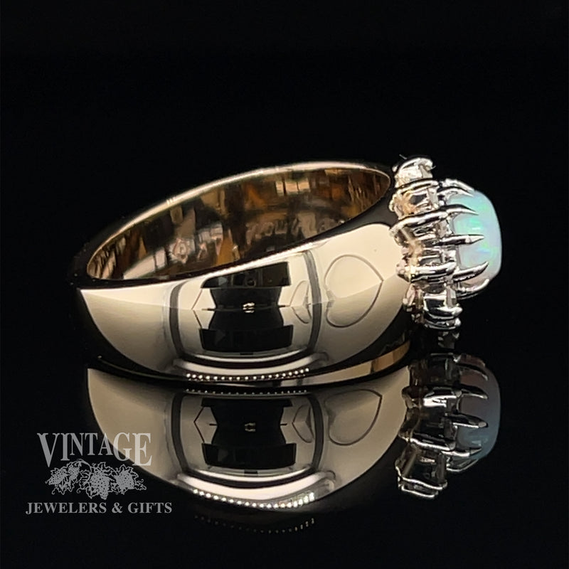 14 karat yellow gold opal and diamond sideways halo ring, side view. Note: There are no hearts or black areas on the band of the ring. It is camera reflection