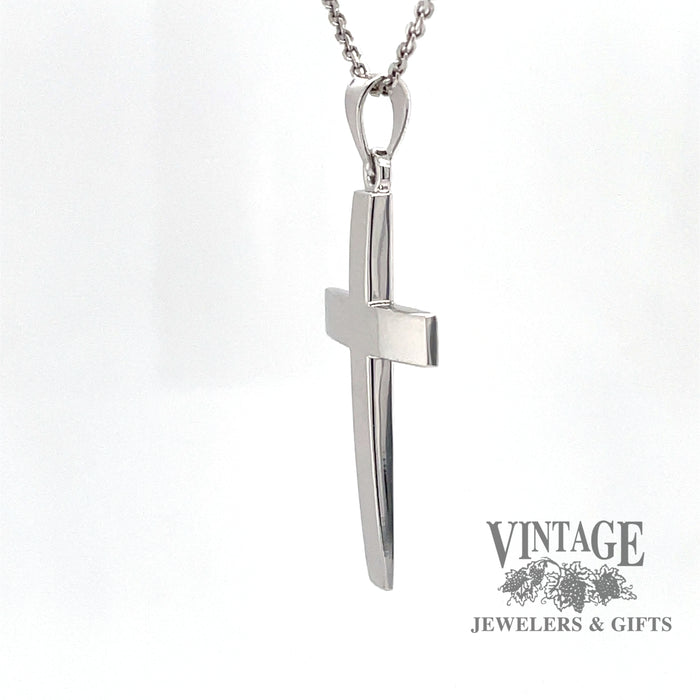 Classic 14 karat white gold solid polished cross pendant, side view