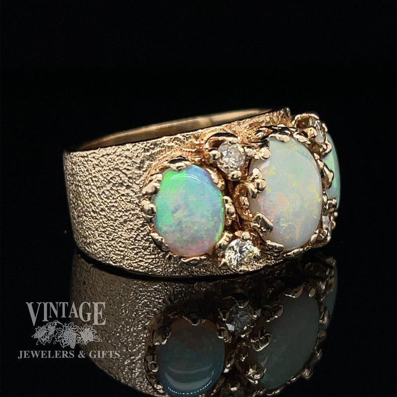 14 karat yellow gold three stone crystal opal and diamond ring, angled view