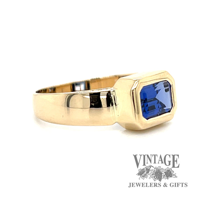 Emerald cut blue cubic zirconia in 14ky gold ring Angle