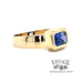 Emerald cut blue cubic zirconia in 14ky gold ring Angle