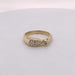 18 karat yellow gold pave diamond ring with 1 bezel set diamond.