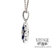 side view 18 karat white gold sapphire diamond flower pendant