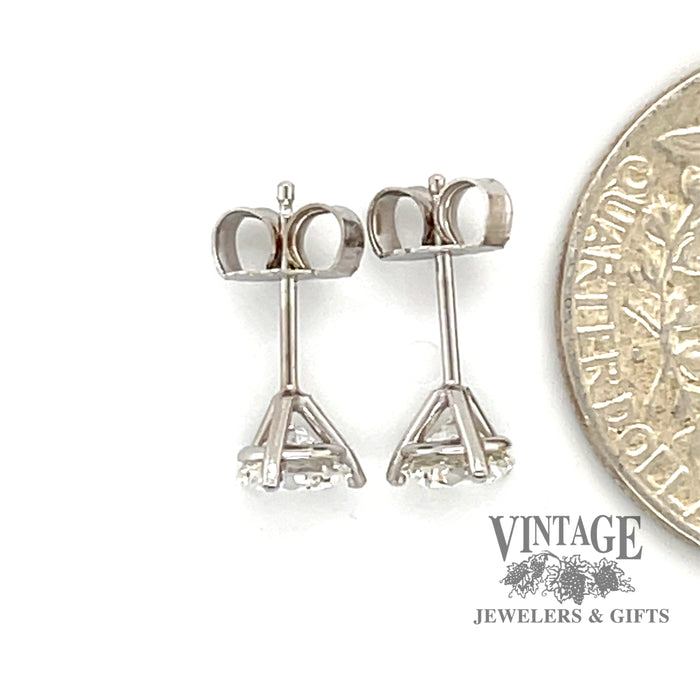 14 karat white gold 1.02 carat total weight natural diamond martini style stud earrings, shown next to quarter for size reference