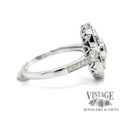 14 karat white gold .63 carat total weight natural blue sapphire and diamond ring, side view