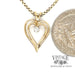 14 karat yellow gold diamond open heart pendant, shown with quarter for size reference