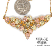 Black Hills Gold necklace 10k and 12k multi-color gold, shown with quarter for size reference