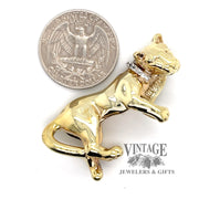 14 karat yellow gold and diamond panther slide necklace with quarter for size comparison