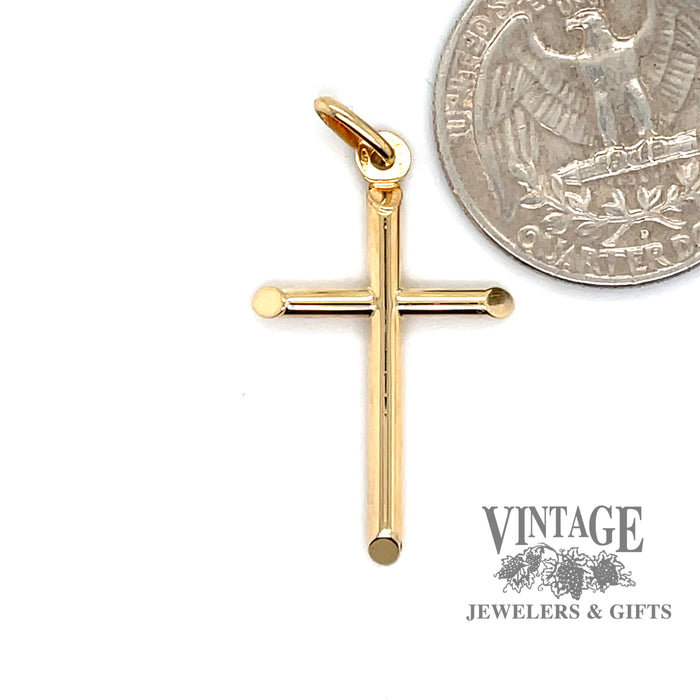 Hollow cross in 14ky gold quarter for scale