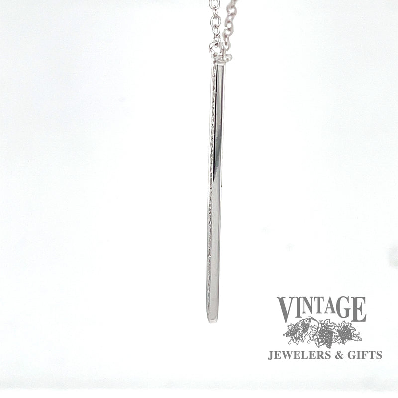 Side view of 14 karat white gold diamond bar pendant