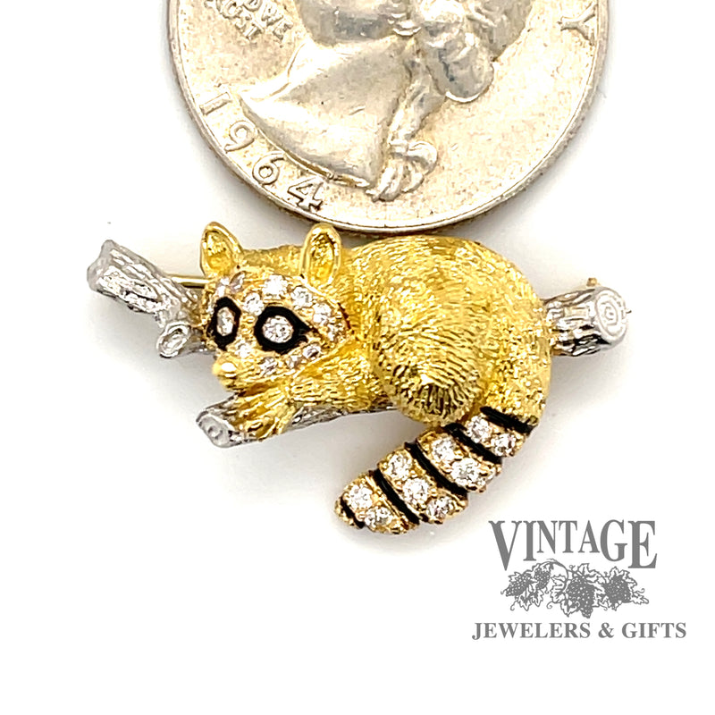 Tiffany & Co. vintage Raccoon 18 karat yellow gold and platinum diamond pin, shown next to a quarter for size reference