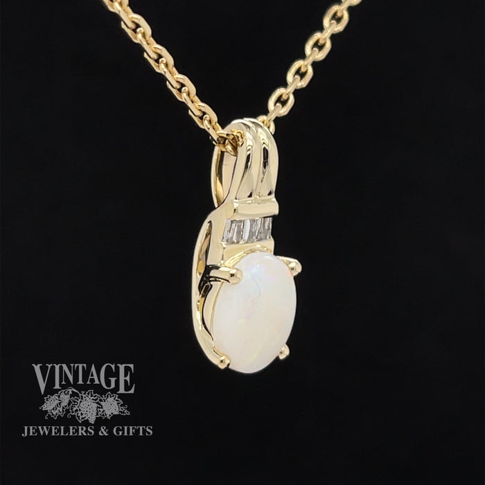 10 karat yellow gold white opal and diamond pendant, angled view