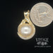 Round Mabe' pearl and diamond 14ky gold pendant quarter for scale