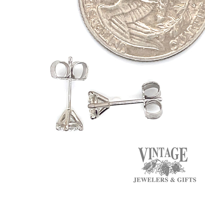 .65 carat 14kw gold diamond stud earrings quarter for scale