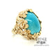 14 karat yellow gold floral design turquoise ring, angled view