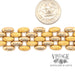 Wide oval link 18ky gold bracelet next to quarter for scale