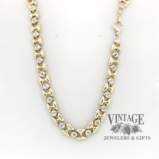 17.5" 10 karat two tone gold bezel set diamond link chain necklace.