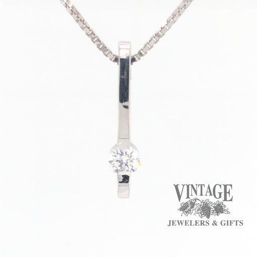 14 karat white gold bar set .25 CT diamond solitaire pendant, front view.