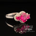 18 karat white gold 3 stone ruby and diamond halo ring, angled view