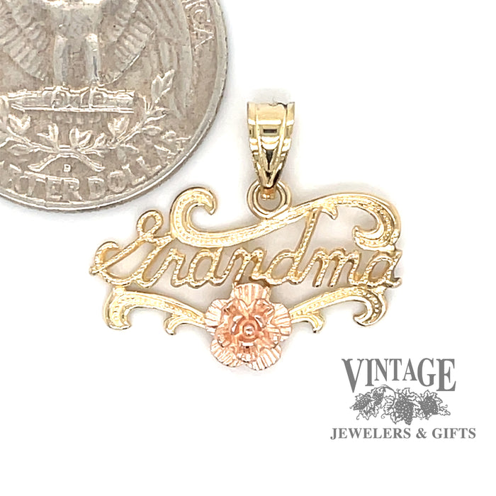 14 karat yellow and rose gold Grandma charm with rose embellishment, shown with quarter for size reference