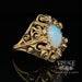 Opal and diamond 14ky gold scroll ring perspective