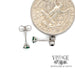 14 karat white gold .20 carat total weight emerald martini stud earrings, shown with quarter for size reference