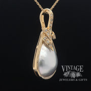 Mabe' pearl and diamond 14ky gold pendant angle