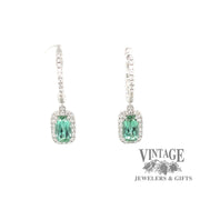 14 karat white gold diamond huggie drop earrings with stunning teal colored tourmalines