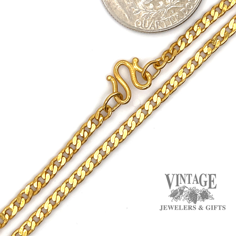 22” 3.0m solid curb link 24 karat gold chain, shown with quarter for size reference