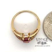 10 karat yellow gold 1.16ct Pink tourmaline filigree ring, side view through finger, shown next to quarter for size reference