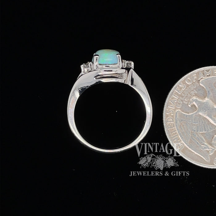 Crystal opal ring in white gold with diamonds quarter for scale