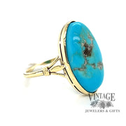 14 karat yellow gold oval turquoise ring with matrix, angled view