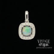 14 karat white gold .33ct Opal and diamond halo pendant