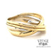 Contemporary 18 karat two tone, yellow and white gold multi-band look ring, angled view