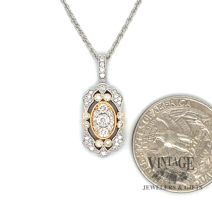 14 karat two tone vintage inspired .50ctw diamond cluster pendant, shown with quarter for size reference