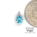 14 karat white gold 1.13 carat blue zircon pendant, shown with quarter for size reference