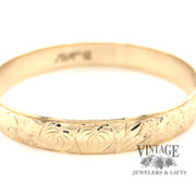 14 karat yellow gold floral solid bangle bracelet
