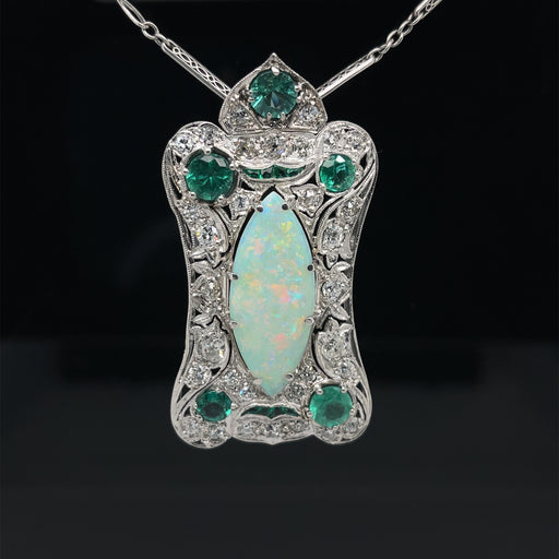 Platinum pendant with opal, emerald and diamond