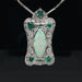 Platinum pendant with opal, emerald and diamond