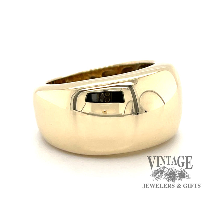 14 karat yellow gold wide domed and tapered band, angled view