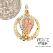 Black Hills Gold 10/12 karat gold pendant quarter for scale