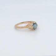 Picture of 14 karat yellow gold natural alexandrite ring from an angled view of front and side.