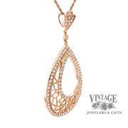 18 karat rose gold 1.29 carat total weight diamond pear shape pendant, angled view