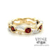 Garnet and diamond 14k two tone gold wave ring