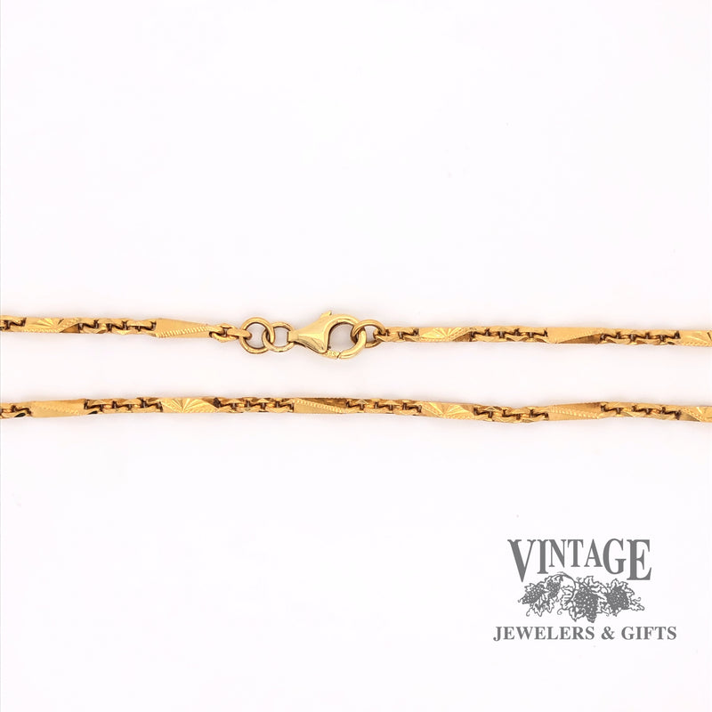 Picture of 22 karat yellow gold  fancy link chain showing section with lobster clasp.